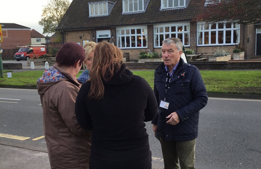 Cllr Brian Holmes talking to local residents about the plans for the phone mast